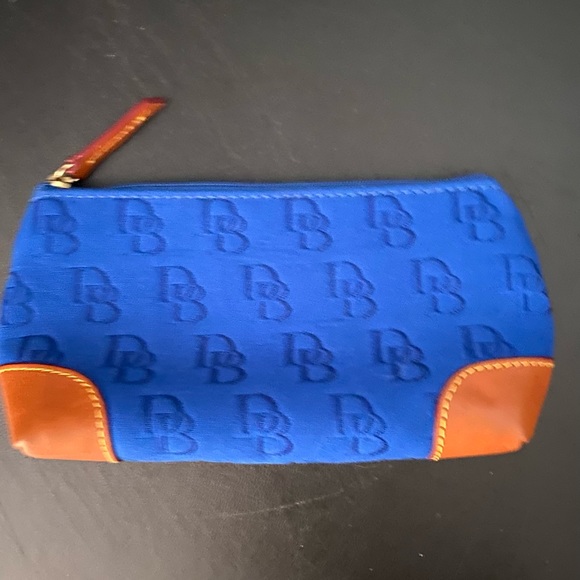 Dooney & Bourke Accessories - Auth Dooney & Bourke cosmetic case blue and tan. Brand new. Never used.